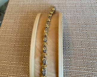 #51 - Purchased at Bere Jewelers, white and yellow gold round diamonds bracelet. $1575. 