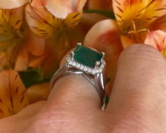 #4 -  White gold 10kt custom setting from Bere. Emerald cut emerald 3.03 cts, diamond bezel, $2,895 