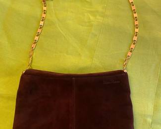 #103 - Paloma Picasso brown swede purse in mint condition, transfor to a clutch or small purse.  $120