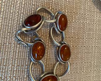 #78  - Sterling bracelet with 5 amber cabochon - one amber cabochon is damaged $100 as is 