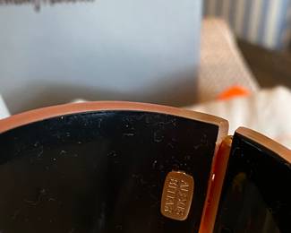 #49 Alexis Bittar orange lucite cuff (7" diam) with rhinestine - with original felt bag and Neiman and Marcus box.  $130