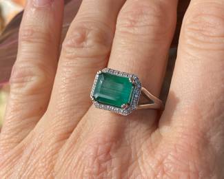 #4 -  White gold 10kt custom setting from Bere. Emerald cut emerald 3.03 cts, diamond bezel, $2,895 