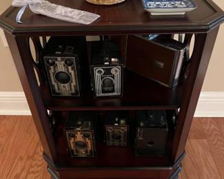 Antique cameras, sweet grass/Gullah Gullah basket, fine porcelain bowls and dishes