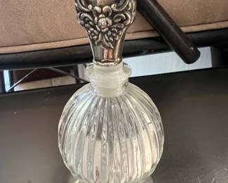Perfume with silver stopper