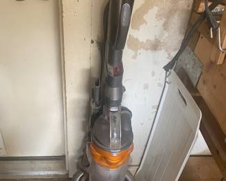 Two Dyson vacuums