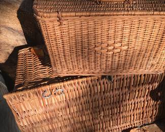 Wicker baskets of several types and descriptions.   One very large picnic type!