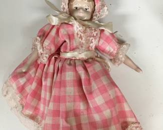 Lovely china doll with matching dress and bonnet!