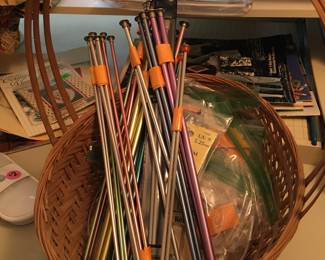 TONS of knitting needles, yarn of every color and weight, sewing machines, sewing cabinet, material, sewing notions, etc!  Embroidery kits and hoops!