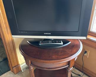 25” Samsung TV w/stand & remote

Round side table w/small drawer
26x26x24