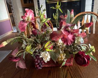 Faux silk flower arrangement in ceramic basket 