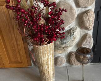 Tall glass vase w/faux berries branches
Glass candle holder shaped like long stemmed wine glass