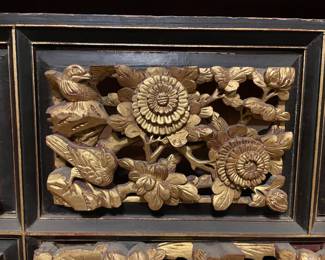 Detail on the hand carved wood Chinese gilt decorated architectural element with multiple panels 