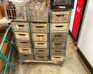 SEVERAL WOODEN MILK CRATES AND BOTTLES