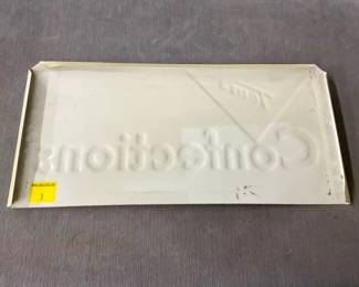 BACK VIEW TOM'S EMB. RACK SIGN 