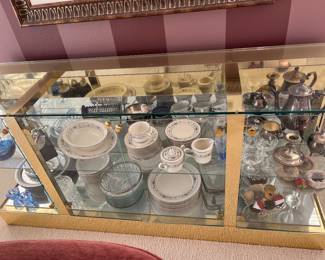 Misc kitchen items inside glass display case