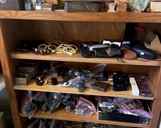 Lots of ammo, shells, sunglasses, misc. rifle parts.