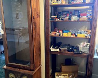Gun cabinet with light and peg board back. Misc. ammo, gun parts, BB’s, etc.