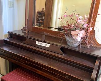 Antique piano with separate mirror with shelf.
