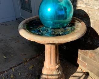 concrete birdbath, and witches ball