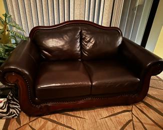 Loveseat has damage to right side, see next photo