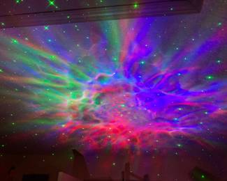 Astronaut Nebula lights shining on the ceiling 