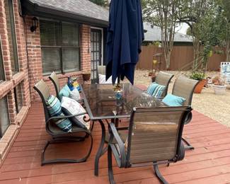 large patio set=table and 6 chairs and umbrella  