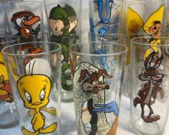 23 1970s Looney Tunes Warner Brothers Pepsi Collectible Glasses - Roadrunner and Wile E Coyote, 2 Tasmanian Devil, Porky Pig, 2 Sylvester, 2 Speedy Gonzalez, 2 Road Runner, Yosemite Sam, 2 Elmer Fudd, 2 Beaky Buzzard, Tweety, 2 Daffy Duck, and 2 Bugs Bunny Character Drinking Glasses
