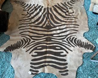 An authentic Cow Hide in Mint condition. I learned today about the method used for making the design. Our neighbor, Bruce, not to be confused with Mr. Rogers is quite the teacher! The only problem with him is he is constantly slamming doors! 