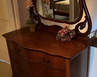 Yet another mirrored dresser is shown here.