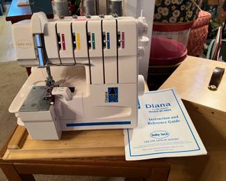 This is a Diana "baby lock" serger, model BL480A.  You'll want to acquire this one, as serger's are not as common as sewing machines.
