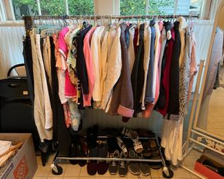 Here is one rack of clothing and shoes for the sale.