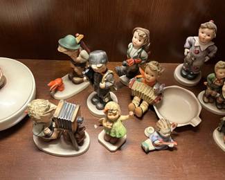 Several of these figurines are from Hummel.  In addition to these, the sale features several Beatrix Potter books & figurines.