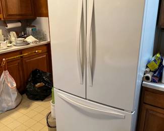 This side-by-side, bottom-freezer refrigerator is a Whirlpool model.