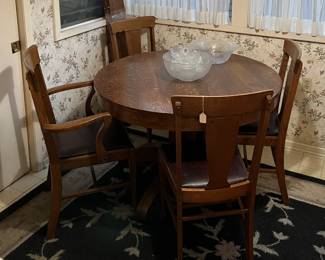This small dining table (or is it a breakfast table: you decide) has four matching chairs with it.