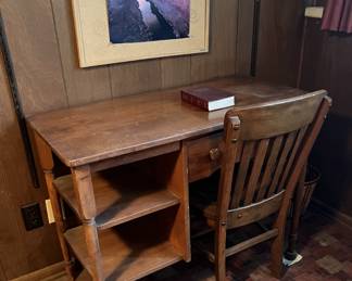 One of several desks and chairs in the sale.  There are also a number of framed artworks in the sale (although this is a poster on a cork bulletin board.)