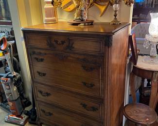 This tall dresser has good storage space, and holds up a lamp very well.  So does the small round table on the bottom right of the image.  