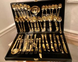 Gold washed flatware in case