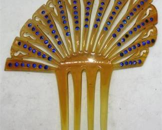 Lot 072   3 Bid(s)
Large celluloid rhinestone hair comb