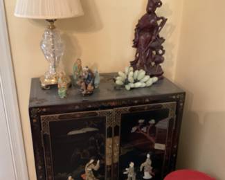 Asian Storage Cabinet with black lacquer finish and abalone carvings 