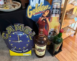 Camel, beer and liquor signs and bottles 