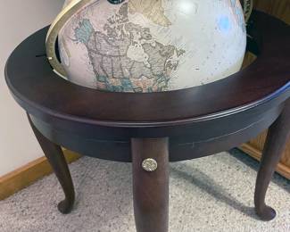 Large world globe in handsome wood stand