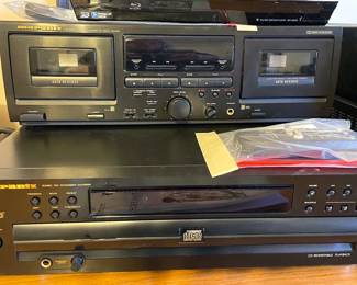 Sony 5-disc CD changer, VCR player, 72" TV, DVD player, CD stereo/radio
Marantz Stereo receiver, double cassette deck player, 5-disc CD changer, Receiver SR-4120, small speakers