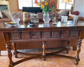 Carved wood sofa table with fold-out wings
