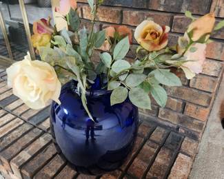 Big blue vase with flowers