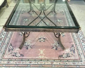Large glass top coffee table with metal base
