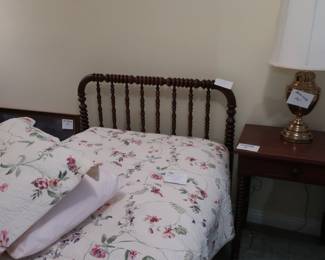 one  of  two  twin  beds  with  headboards