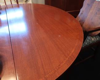 antique    cherry  dining room  table  and  8  chairs  it  has  two  leaves  also.