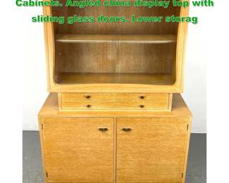 Lot 1212 Paul Lazlo style Modernist Cabinets. Angled china display top with sliding glass doors. Lower storag