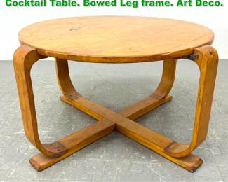 Lot 1531 Round Blond Wood Modernist Cocktail Table. Bowed Leg frame. Art Deco. 