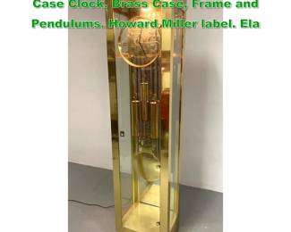 Lot 1559 HOWARD MILLER Brass Glass Tall Case Clock. Brass Case, Frame and Pendulums. Howard Miller label. Ela